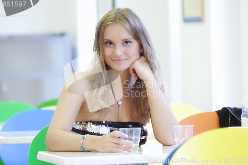 Image of Young woman in cafe