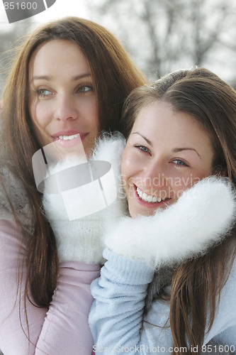 Image of Two women in white mittens