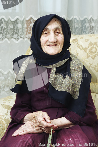 Image of Portrait of smiling senior with beads