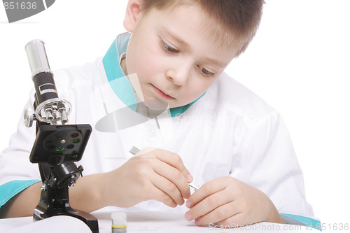 Image of Boy with tweezers and microscope