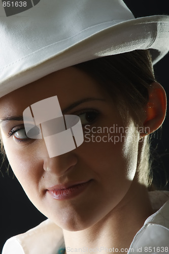 Image of Young woman in hat