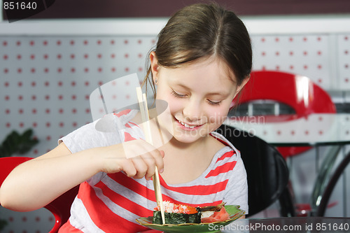 Image of Girl eating sushi