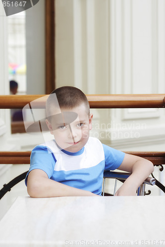Image of Serene boy at table