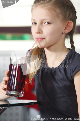 Image of Little girl drinking juice