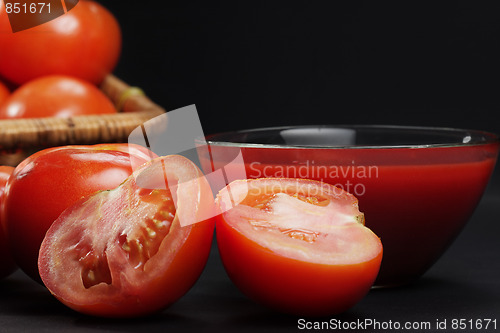 Image of Sliced tomato in darkness