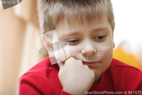 Image of Thoughtful kid in red