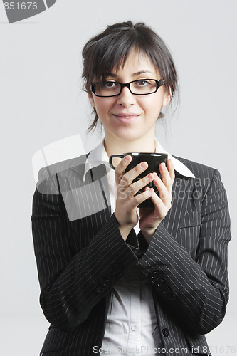 Image of Brunette businesswoman with black cup