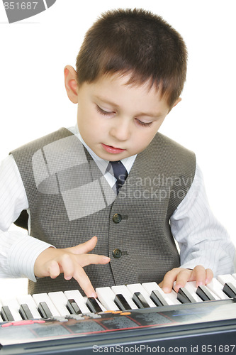 Image of Boy playing electric piano