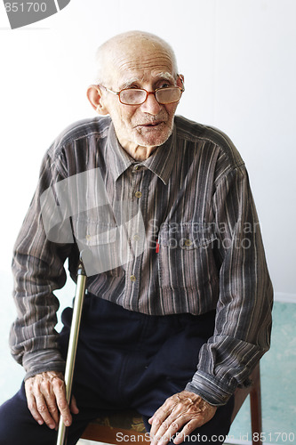 Image of Senior man sitting on chair