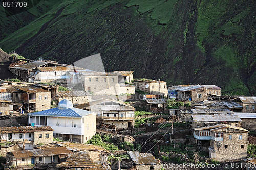 Image of Village against dark mountain