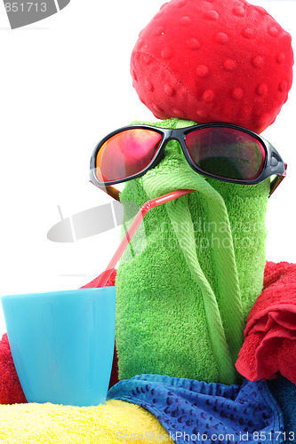 Image of Towel person in red hat with drink