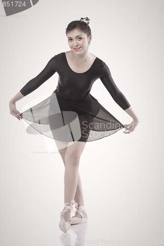Image of Smiling ballerina making a bow