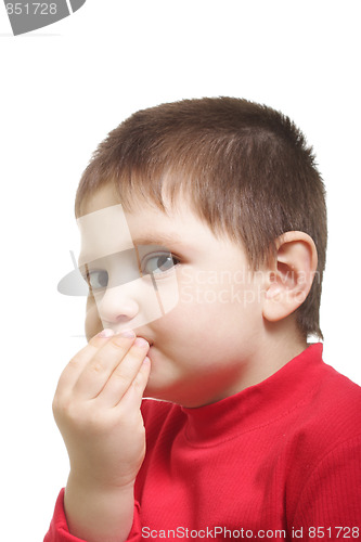 Image of Little boy with hands at mouth