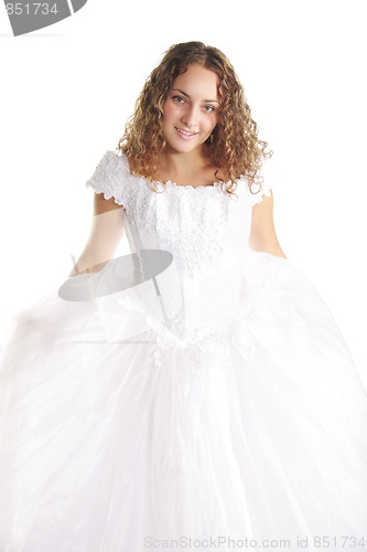 Image of Smiling curly bride in white dress