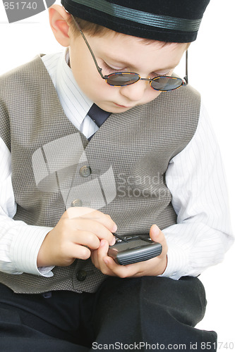 Image of Kid busy with palm computer and stylus 