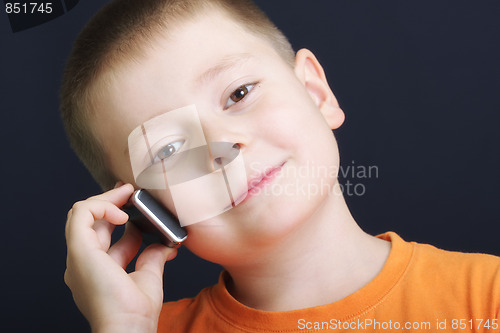 Image of Smiling boy in orange with cellphone