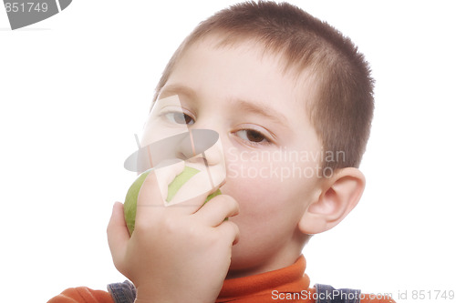Image of Boy eating green apple