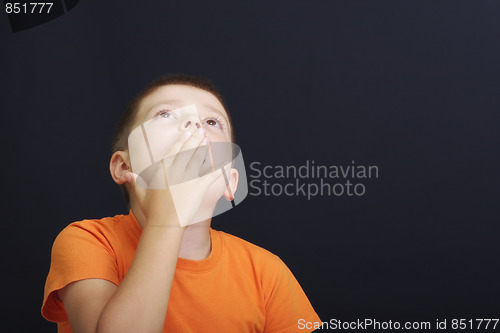 Image of Thoughtful boy looking up