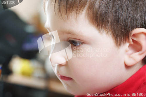 Image of Pensive boy in red