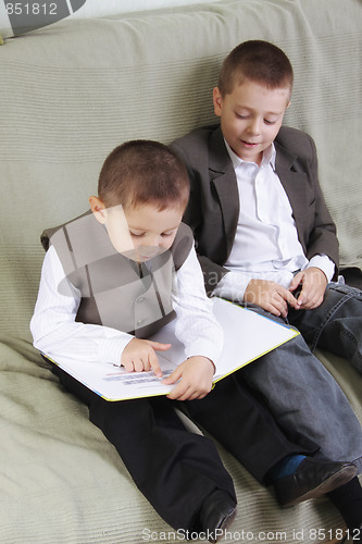 Image of Brothers reading book