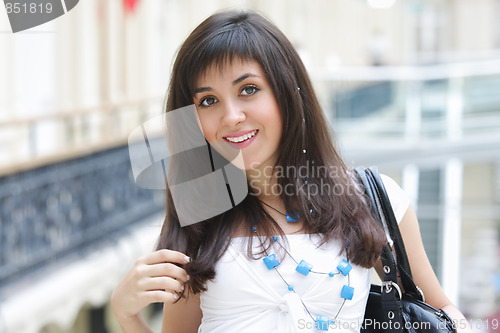 Image of Brunette woman in shopping centre