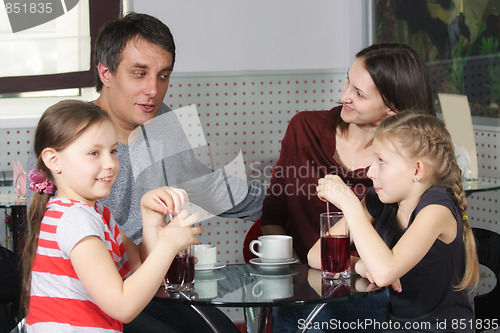 Image of Happy family in cafe