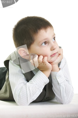 Image of Little kid laying on pale ground