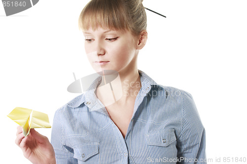 Image of Serene blonde with paper plane