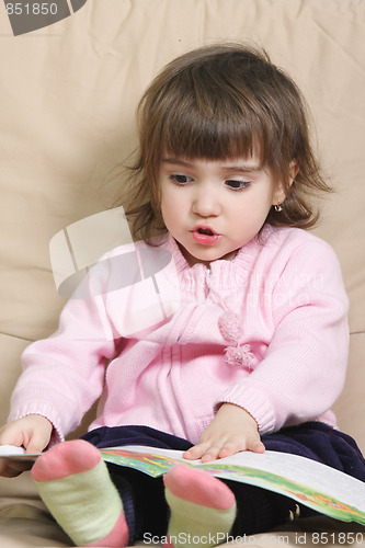 Image of Cute girl reading book