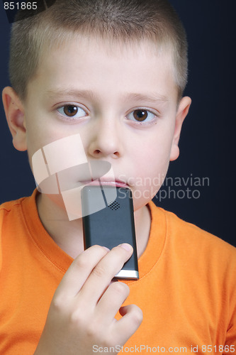 Image of Pensive kid in orange with cellphone