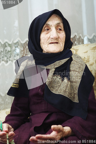 Image of Elderly woman with beads