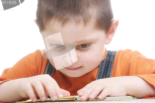 Image of Boy sitting with open book