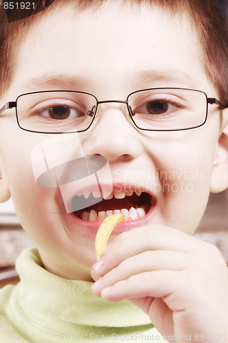 Image of Boy going to eat fried potato