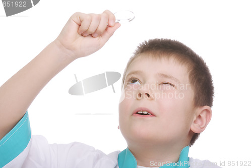 Image of Kid looking up through magnifying glass