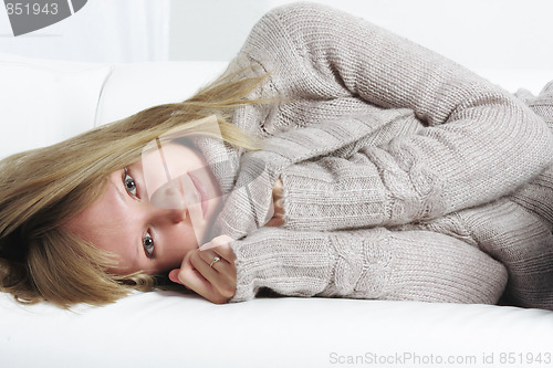 Image of Serene blonde relaxed on sofa