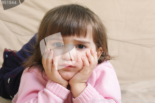 Image of Sad girl on sofa