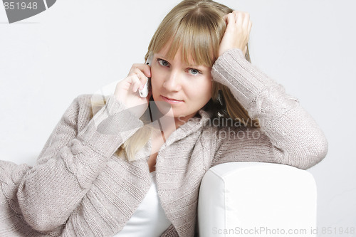 Image of Serene blonde on white cellphone