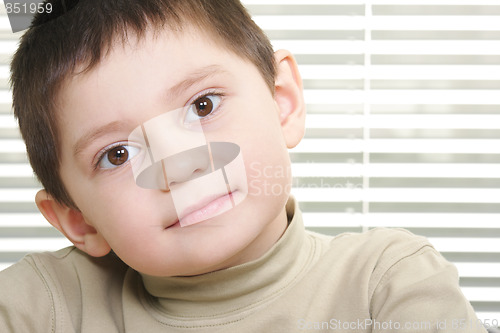 Image of Cute boy against stripes