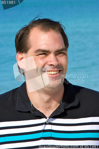 Image of average dark haired man smiling