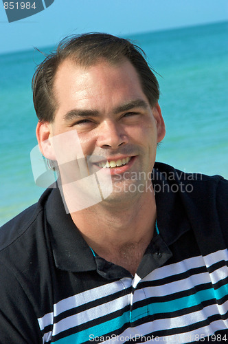 Image of friendly man on beach