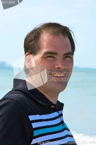 Image of handsome happy man outside