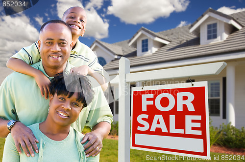 Image of African American Family with For Sale Sign and House