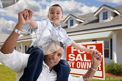 Image of Hispanic Father and Son with For Sale By Owner Sign