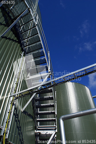 Image of Industrial zone, Steel pipe-lines on blue sky