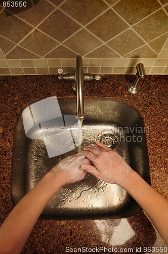 Image of Overview of hand washing over a stainless steel sink