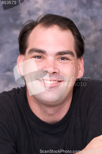 Image of dark haired man portrait