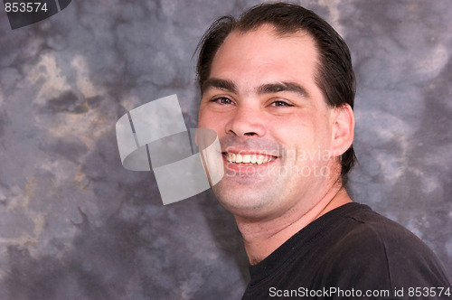 Image of handsome brown eyed man smiling