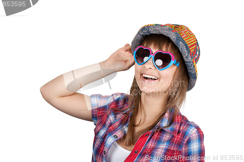 Image of Beautiful girl smiles in sunglasseses and colour hat