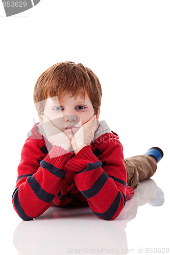 Image of Cute boy, lying on the floor