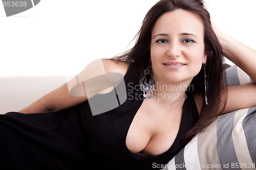 Image of beautiful woman lying on couch